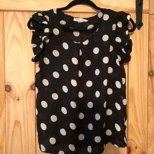 Black top with white polka dots
